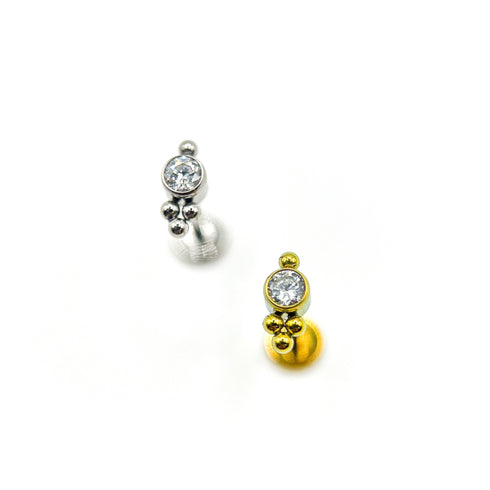 Titāna dārgakmens un trīsvienības pērlīšu labrets